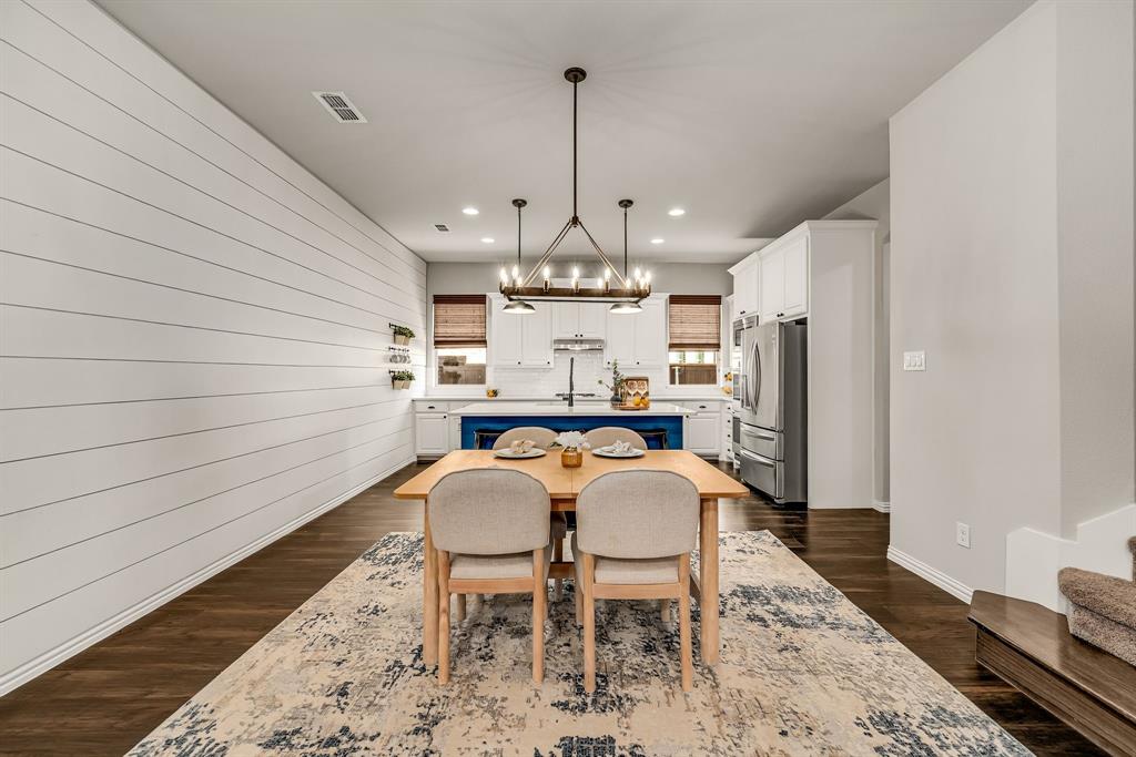 3341 Man O War Road Celina, TX 75009 - Photo 5 of 40 a view of a dining room with furniture
