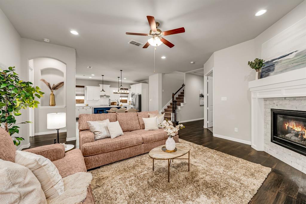 3341 Man O War Road Celina, TX 75009 - Photo 7 of 40 a living room with furniture and a fireplace