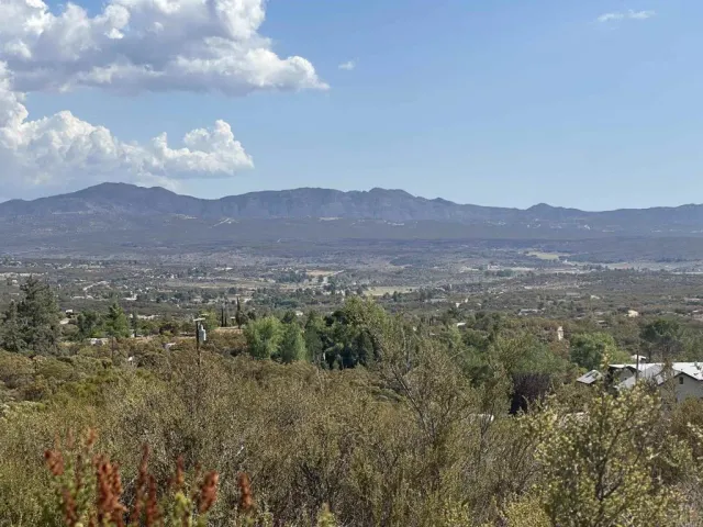 a view of a town with mountains in the background