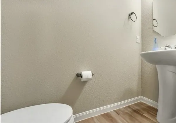 a bedroom with a bed and a television
