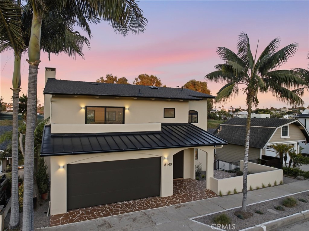 a front view of a house with a garage