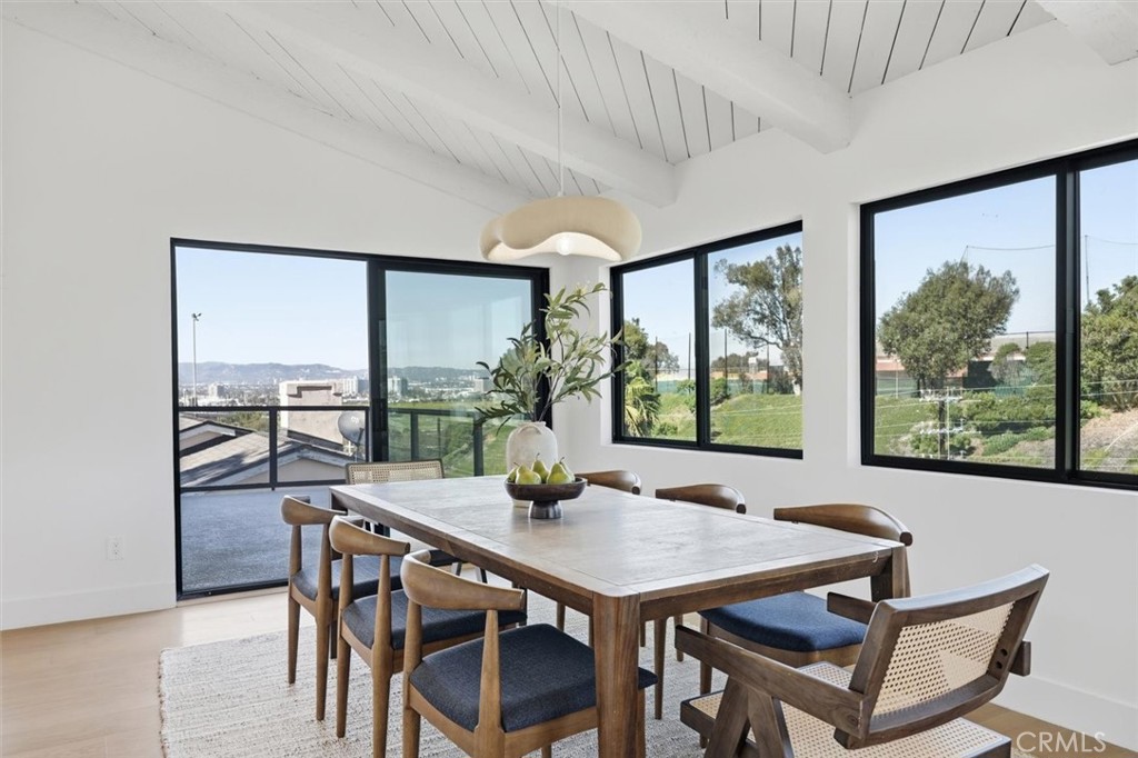 8140 Calabar Avenue Playa del Rey, CA 90293 - Photo 21 of 59 a view of a dining room with furniture large windows and wooden floor