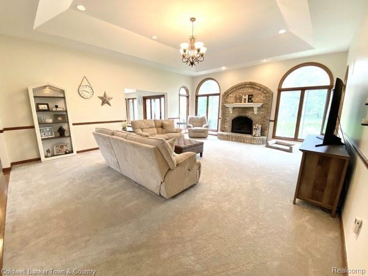 4233 Augusta Court Howell, MI 48843 - Photo 12 of 49 Fabulous Family Room with Gas Fireplace & Floor to Ceiling Windows!