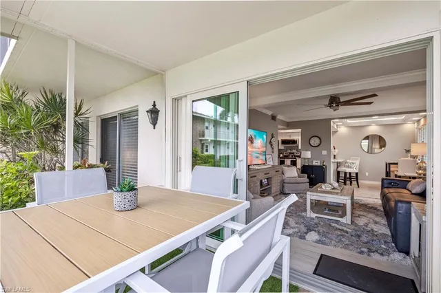 a view of a dining room with furniture and window
