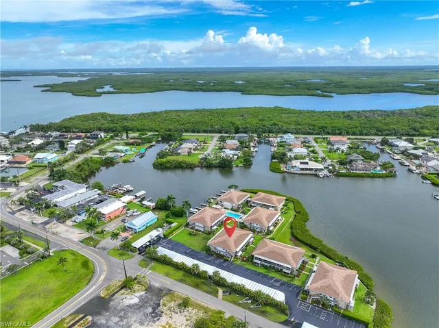 an aerial view of lake residential houses with outdoor space and lake view