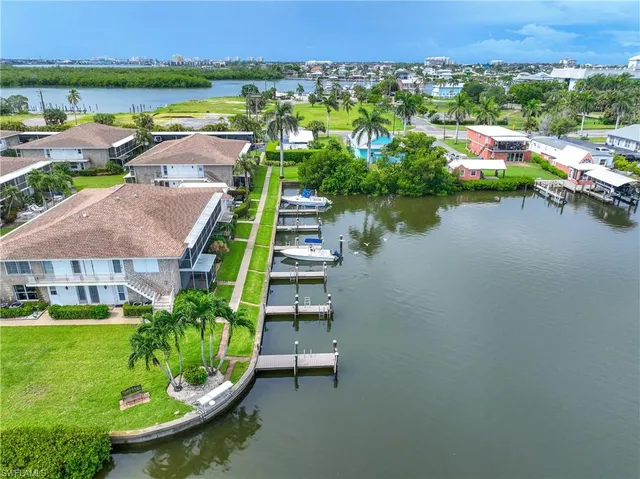 an aerial view of a house with a lake view