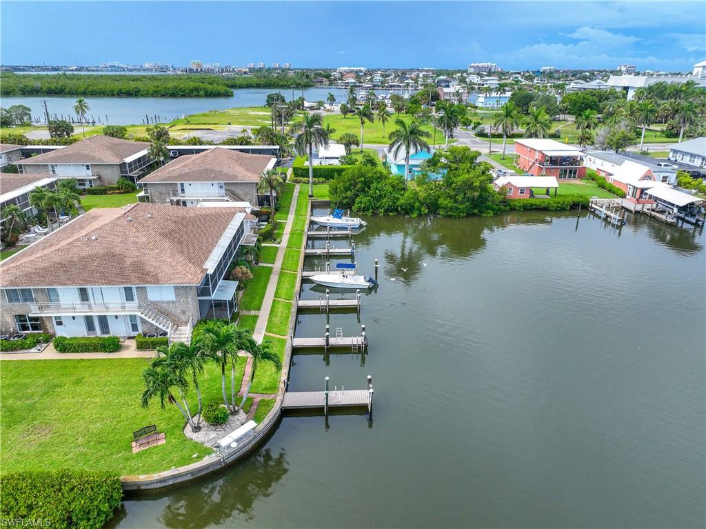 330 Kon Tiki Drive, Unit C7 Naples, FL 34113 - Photo 40 of 50 a view of a lake with a city