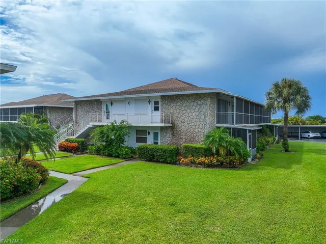 an aerial view of a house with a lake view