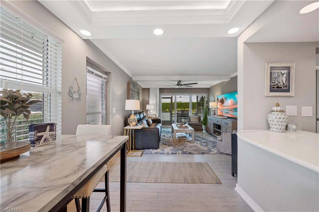 330 Kon Tiki Drive, Unit C7 Naples, FL 34113 - Photo 7 of 50 a very nice looking living room with a large window