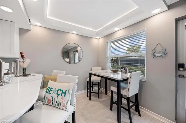 a bathroom with a sink a mirror and a window