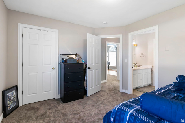13176 Day Court Draper, UT 84020 - Photo 22 of 45 Bedroom featuring light colored carpet and ensuite bath