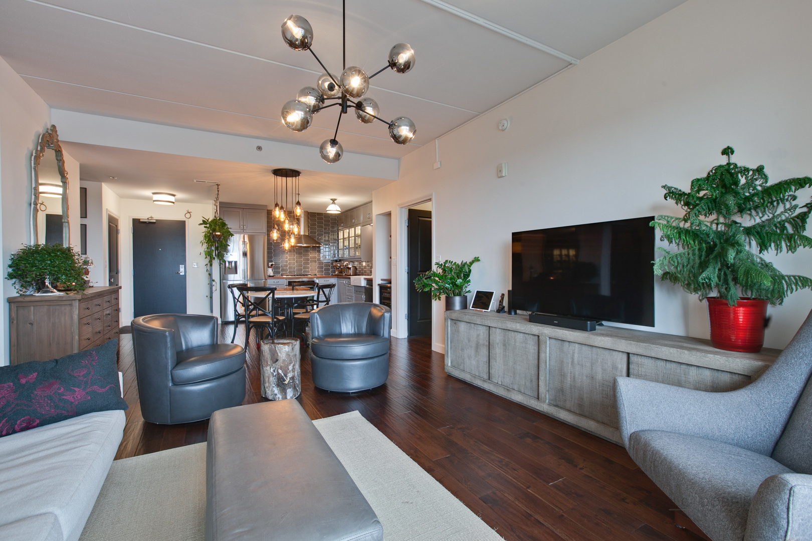1199 East Port Clinton Road, Unit 405 Vernon Hills, IL 60061 - Photo 12 of 29 a living room with furniture and a flat screen tv