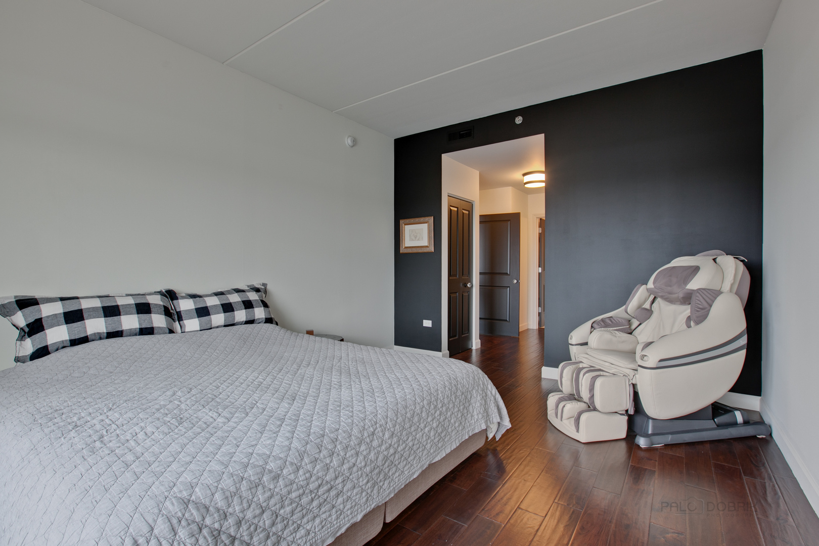 1199 East Port Clinton Road, Unit 405 Vernon Hills, IL 60061 - Photo 15 of 29 a bedroom with a bed and a chair