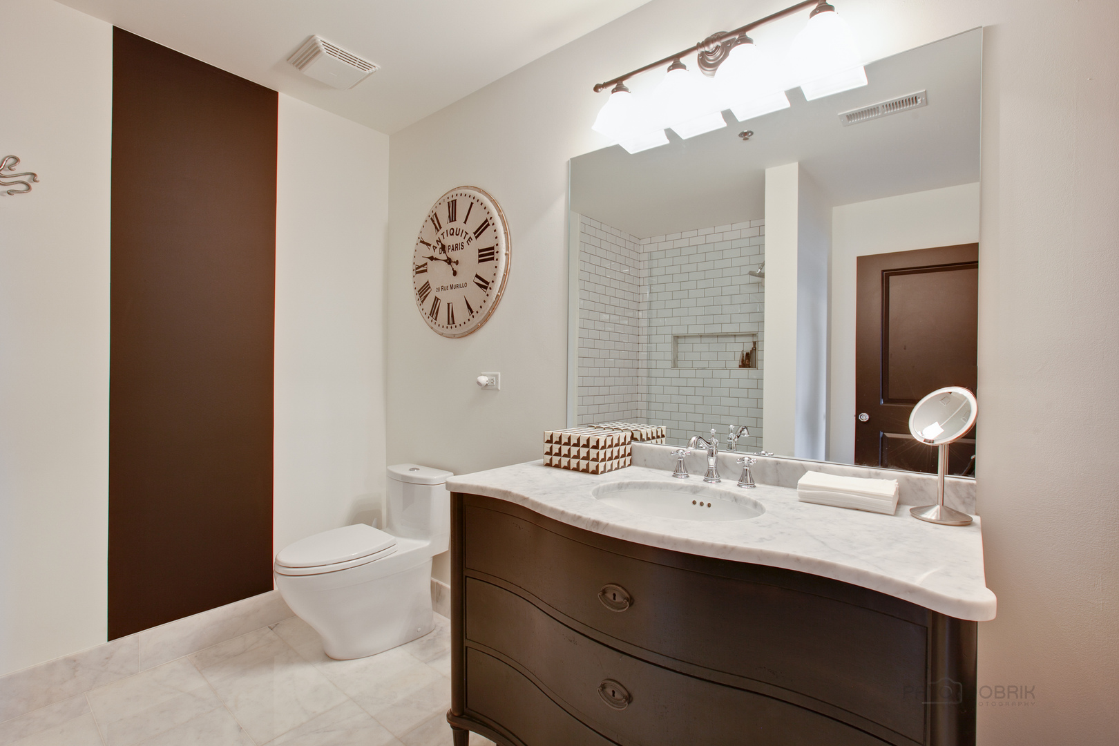 1199 East Port Clinton Road, Unit 405 Vernon Hills, IL 60061 - Photo 19 of 29 a bathroom with a sink and a mirror