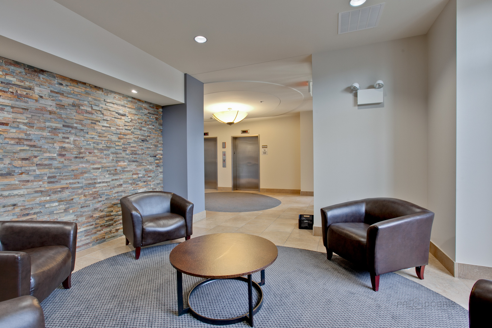 1199 East Port Clinton Road, Unit 405 Vernon Hills, IL 60061 - Photo 26 of 29 a living room with furniture and a fireplace