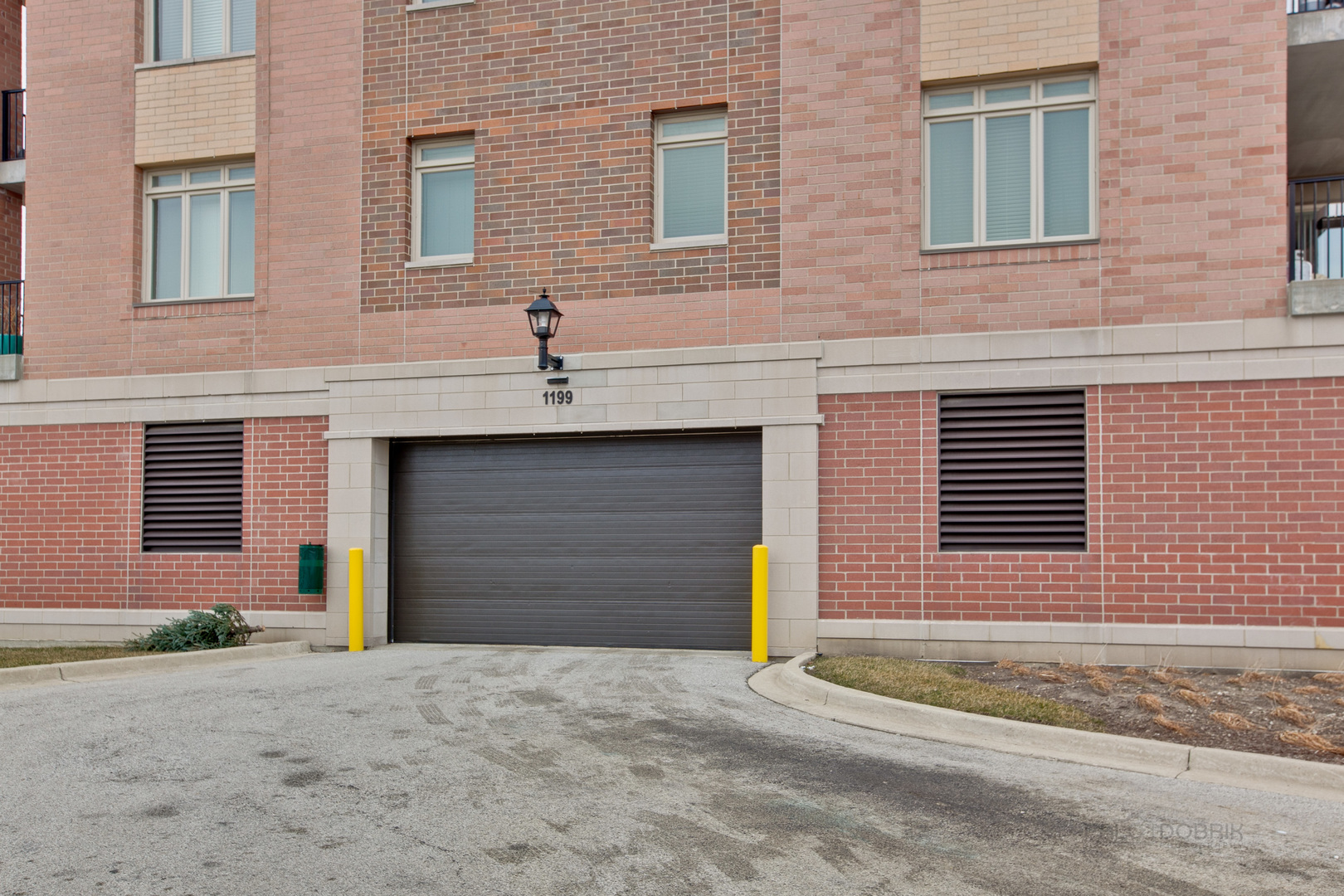 1199 East Port Clinton Road, Unit 405 Vernon Hills, IL 60061 - Photo 28 of 29 a front view of a house with a yard and garage