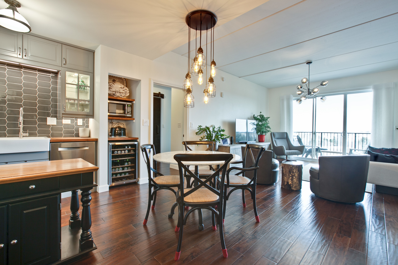 1199 East Port Clinton Road, Unit 405 Vernon Hills, IL 60061 - Photo 9 of 29 a view of a dining room with furniture and wooden floor