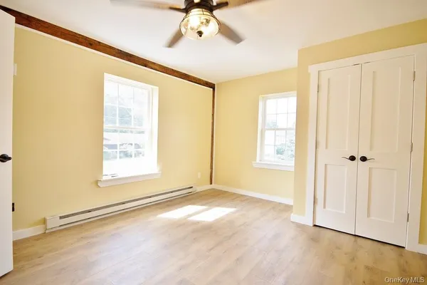 a view of an empty room with a window