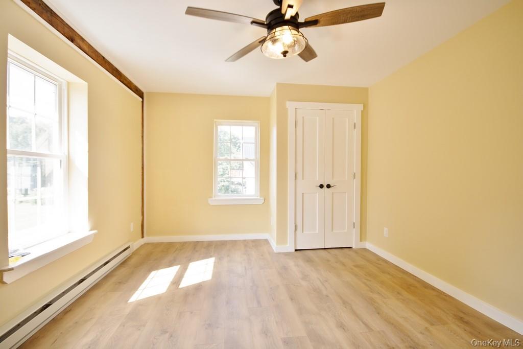 162 Rockland Road Roscoe, NY 12776 - Photo 16 of 36 a view of empty room with wooden floor and fan