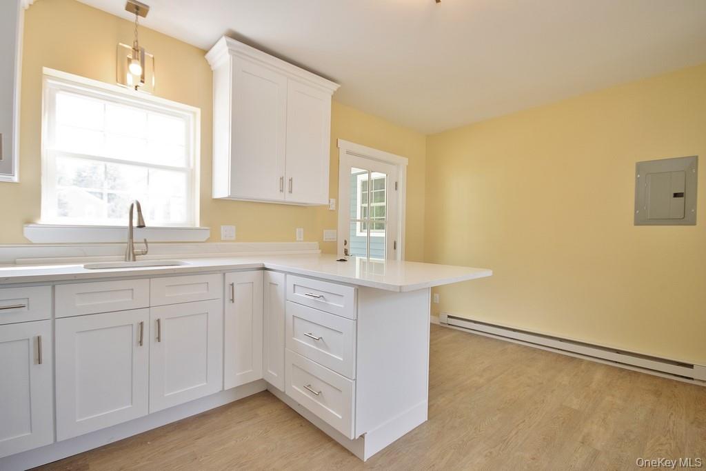 162 Rockland Road Roscoe, NY 12776 - Photo 23 of 36 a kitchen with a sink cabinets and a window