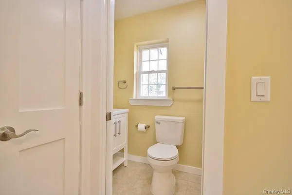 a view of a house with wooden fence