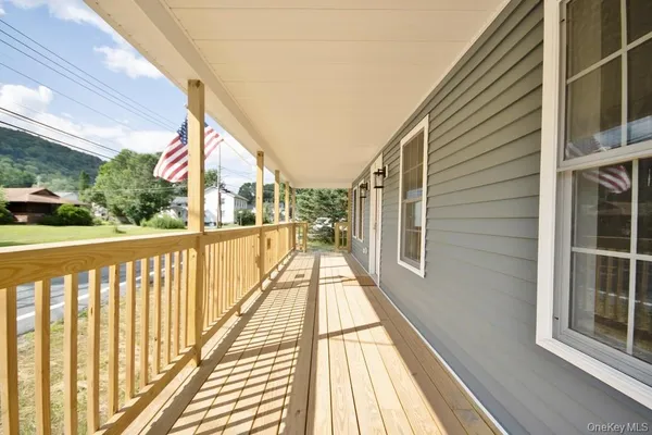 a view of balcony with wooden floor