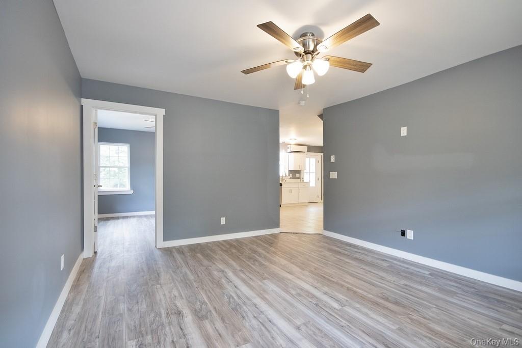 162 Rockland Road Roscoe, NY 12776 - Photo 31 of 36 wooden floor in an empty room with a window