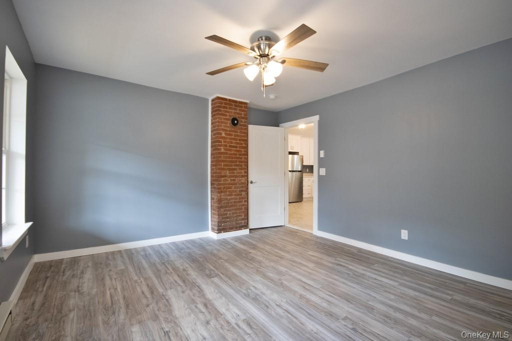 162 Rockland Road Roscoe, NY 12776 - Photo 33 of 36 a view of an empty room with wooden floor and a window