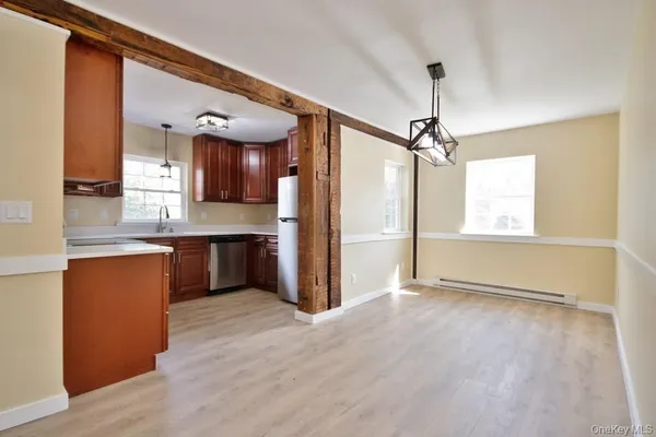 a view of a kitchen with a sink and a window