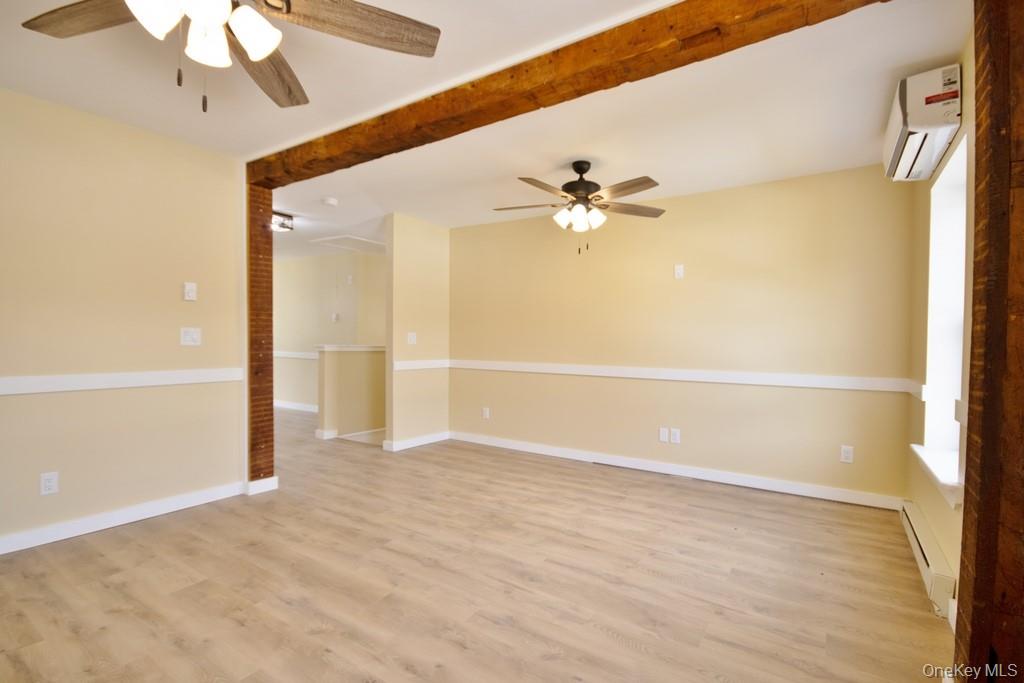 162 Rockland Road Roscoe, NY 12776 - Photo 9 of 36 a view of an empty room with a chandelier fan