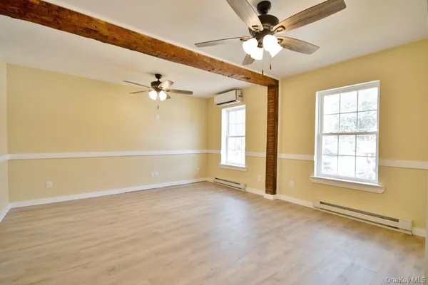 a view of an empty room with a window