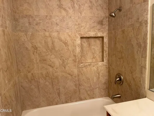 a bathroom with a sink and a shower
