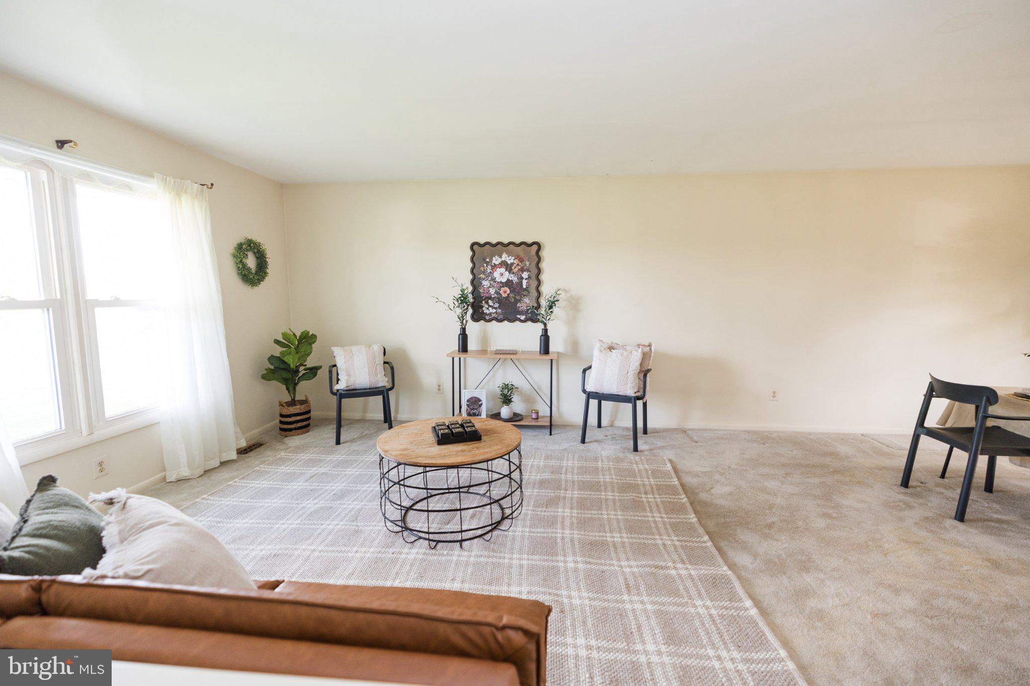 11307 Treeview Lane Monrovia, MD 21770 - Photo 15 of 63 a living room with furniture and a window