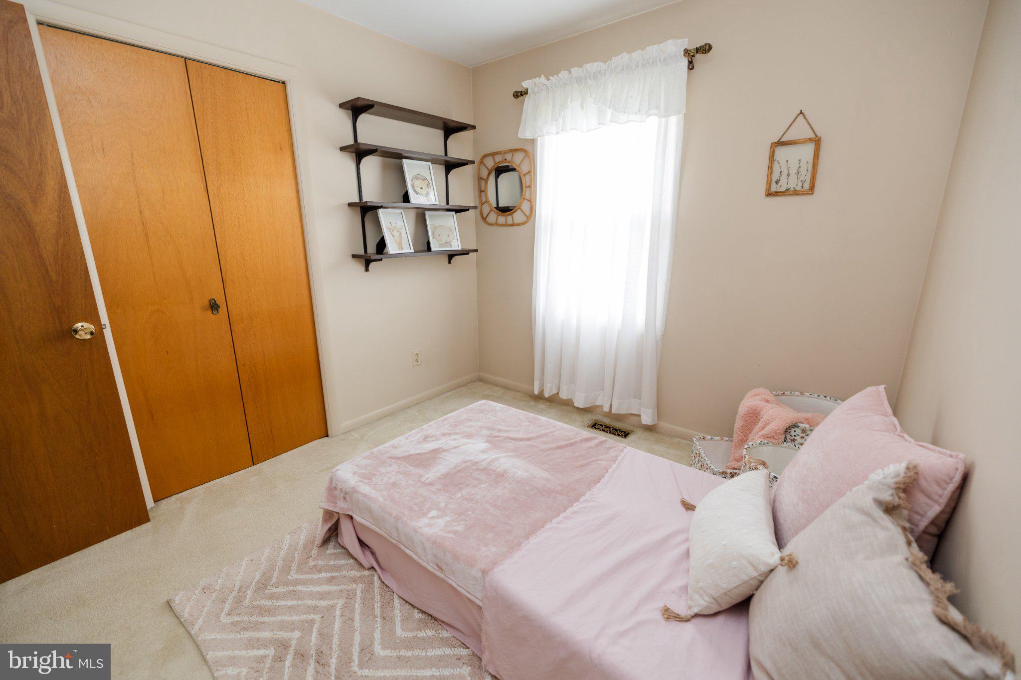 11307 Treeview Lane Monrovia, MD 21770 - Photo 28 of 63 a bedroom with a bed and a window