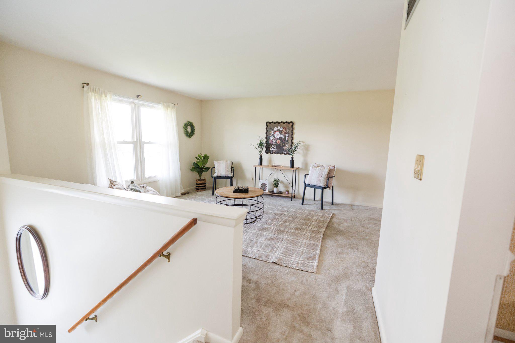 11307 Treeview Lane Monrovia, MD 21770 - Photo 46 of 63 a living room with furniture a table and a window