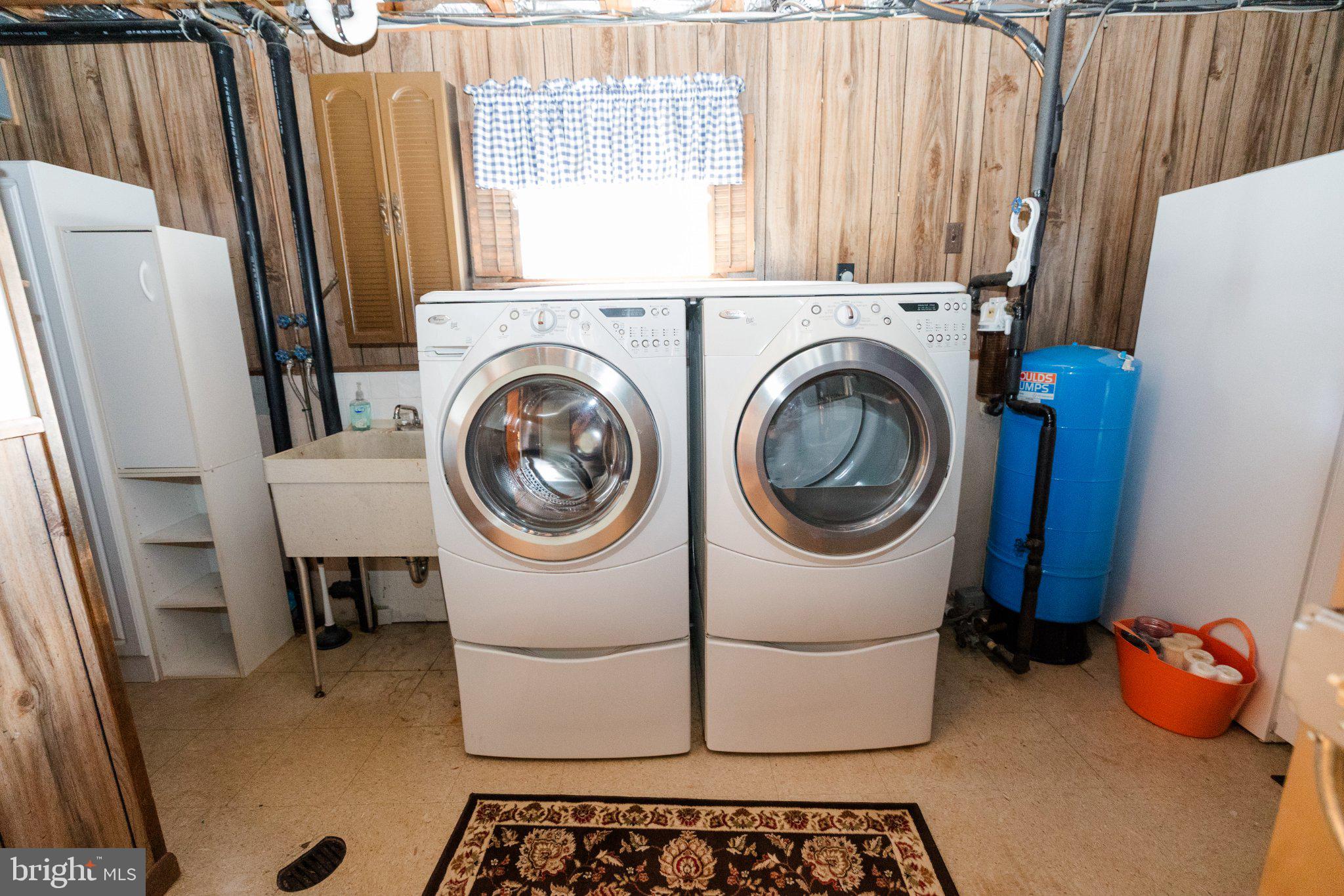 11307 Treeview Lane Monrovia, MD 21770 - Photo 78 of 116 Modern laundry setup in cozy space.