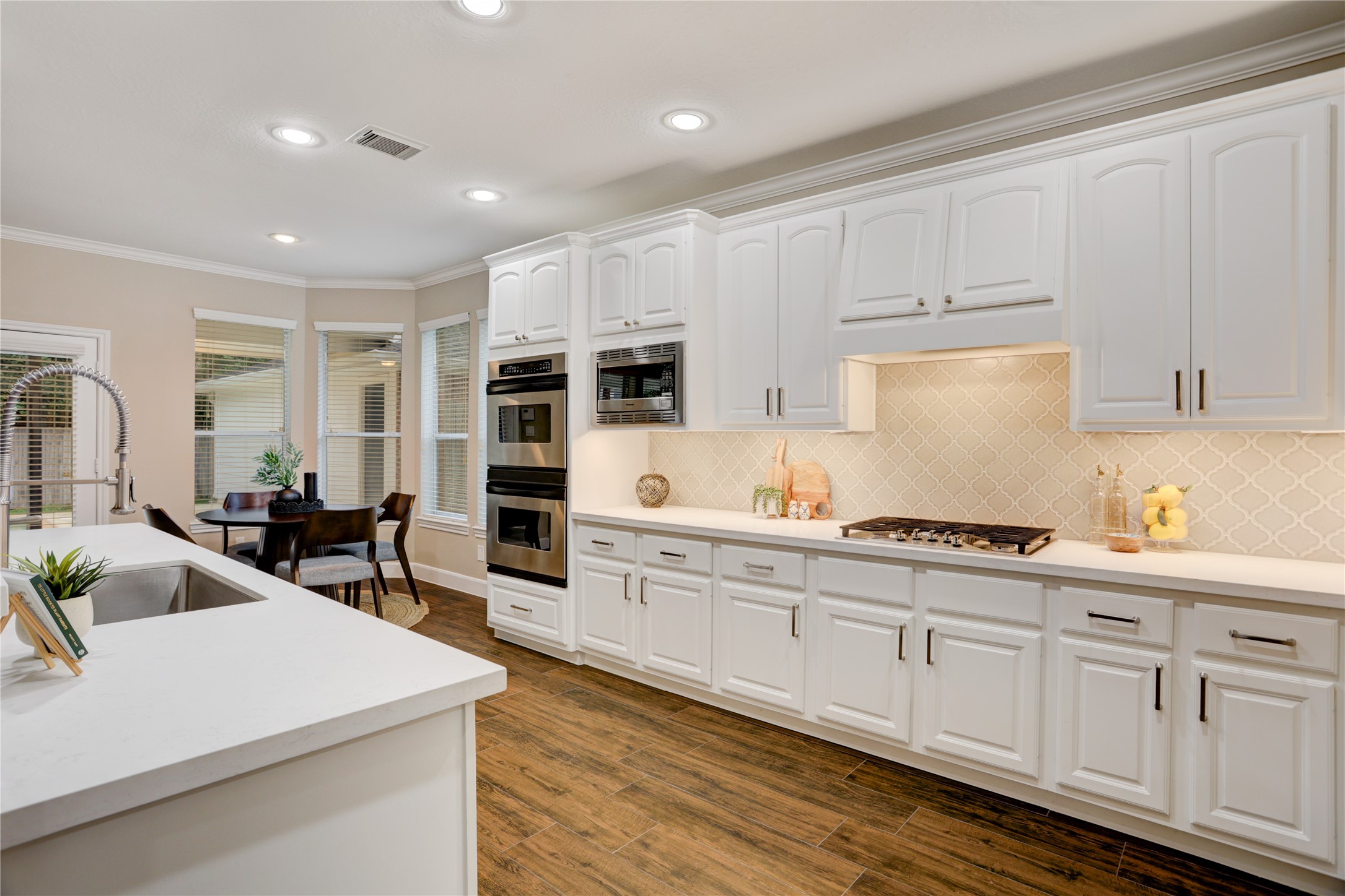 24418 Falcon Point Drive Katy, TX 77494 - Photo 9 of 40 a kitchen with sink cabinets and stove
