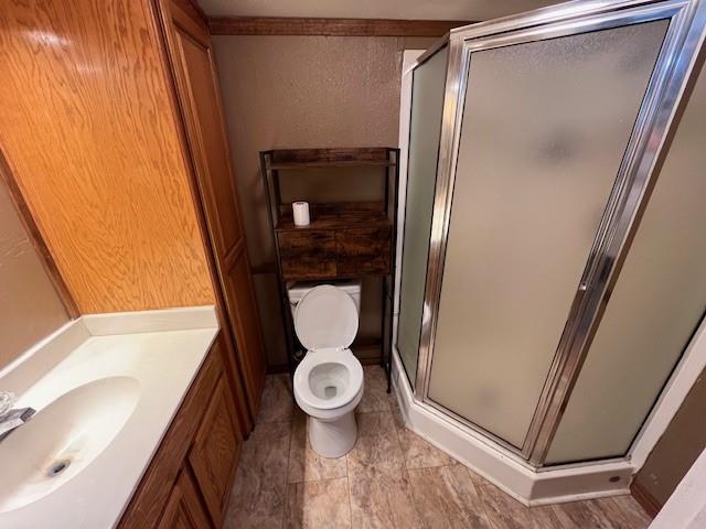 136 Northwest Ave F Hamlin, TX 79520 - Photo 17 of 27 a bathroom with a toilet and a sink