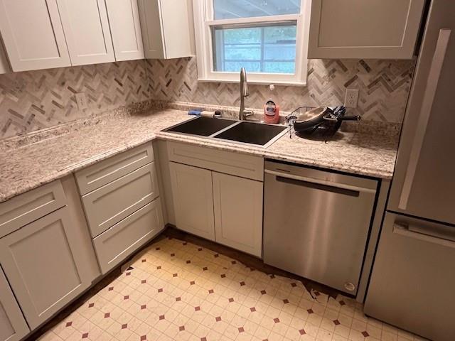 136 Northwest Ave F Hamlin, TX 79520 - Photo 5 of 27 a kitchen with granite countertop a sink and a stove