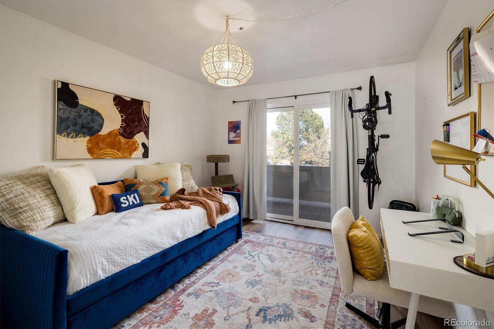 935 Broadway, Unit 104 Boulder, CO 80302 - Photo 14 of 30 a bedroom with bed and a window