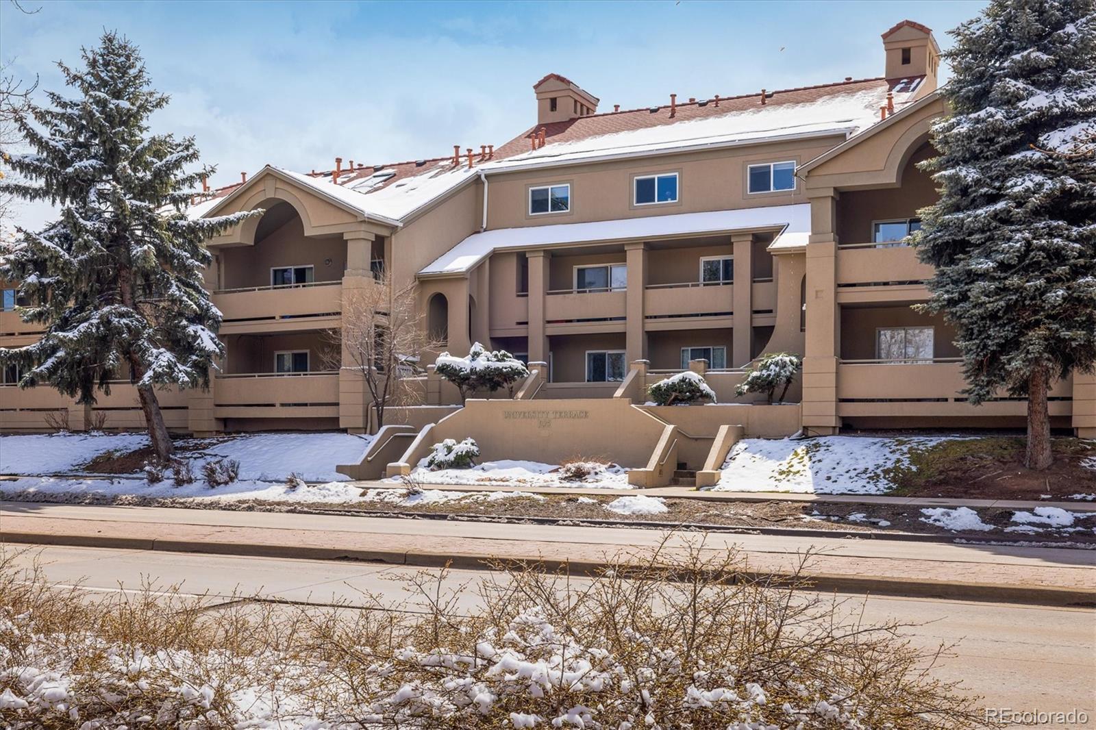 935 Broadway, Unit 104 Boulder, CO 80302 - Photo 16 of 30 a front view of a house with a yard