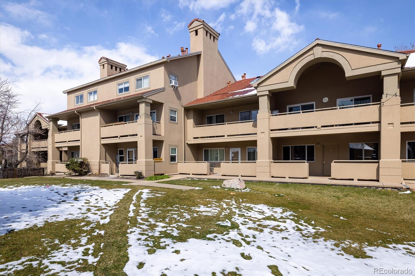 935 Broadway, Unit 104 Boulder, CO 80302 - Photo 18 of 30 a front view of a house with a yard