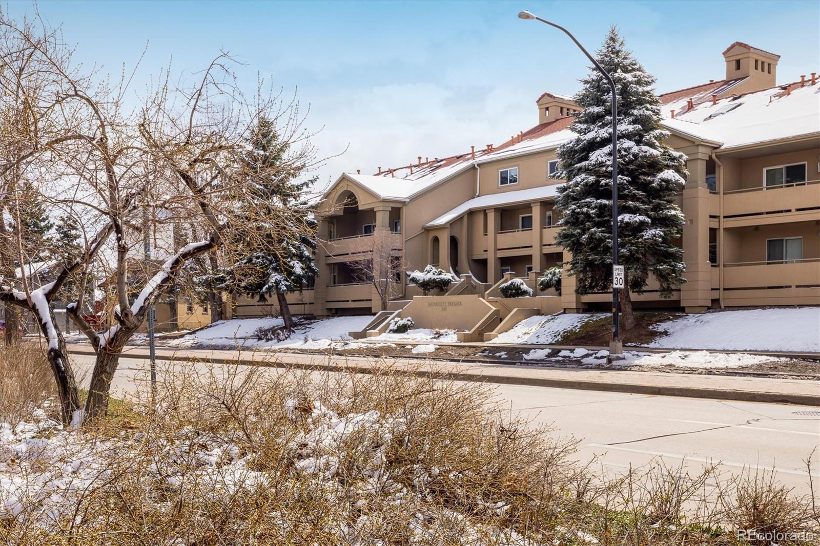 935 Broadway, Unit 104 Boulder, CO 80302 - Photo 23 of 30 a view of a house with snow on the background