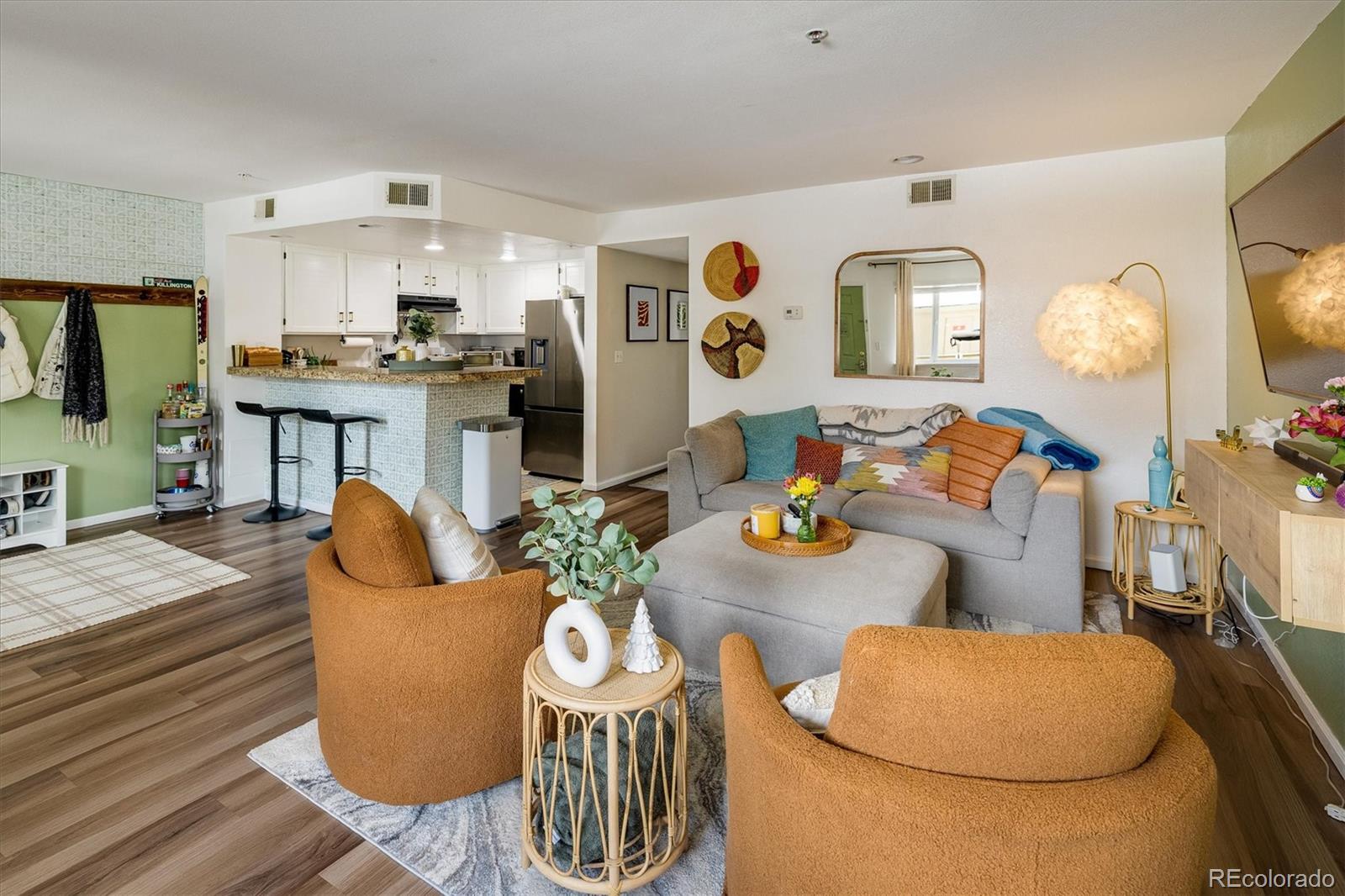 935 Broadway, Unit 104 Boulder, CO 80302 - Photo 5 of 30 a living room with furniture kitchen view and a window