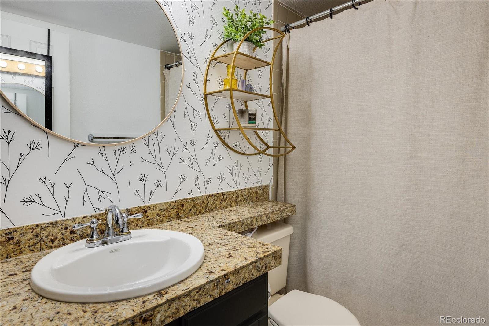 935 Broadway, Unit 104 Boulder, CO 80302 - Photo 9 of 30 a bathroom with a sink and a mirror