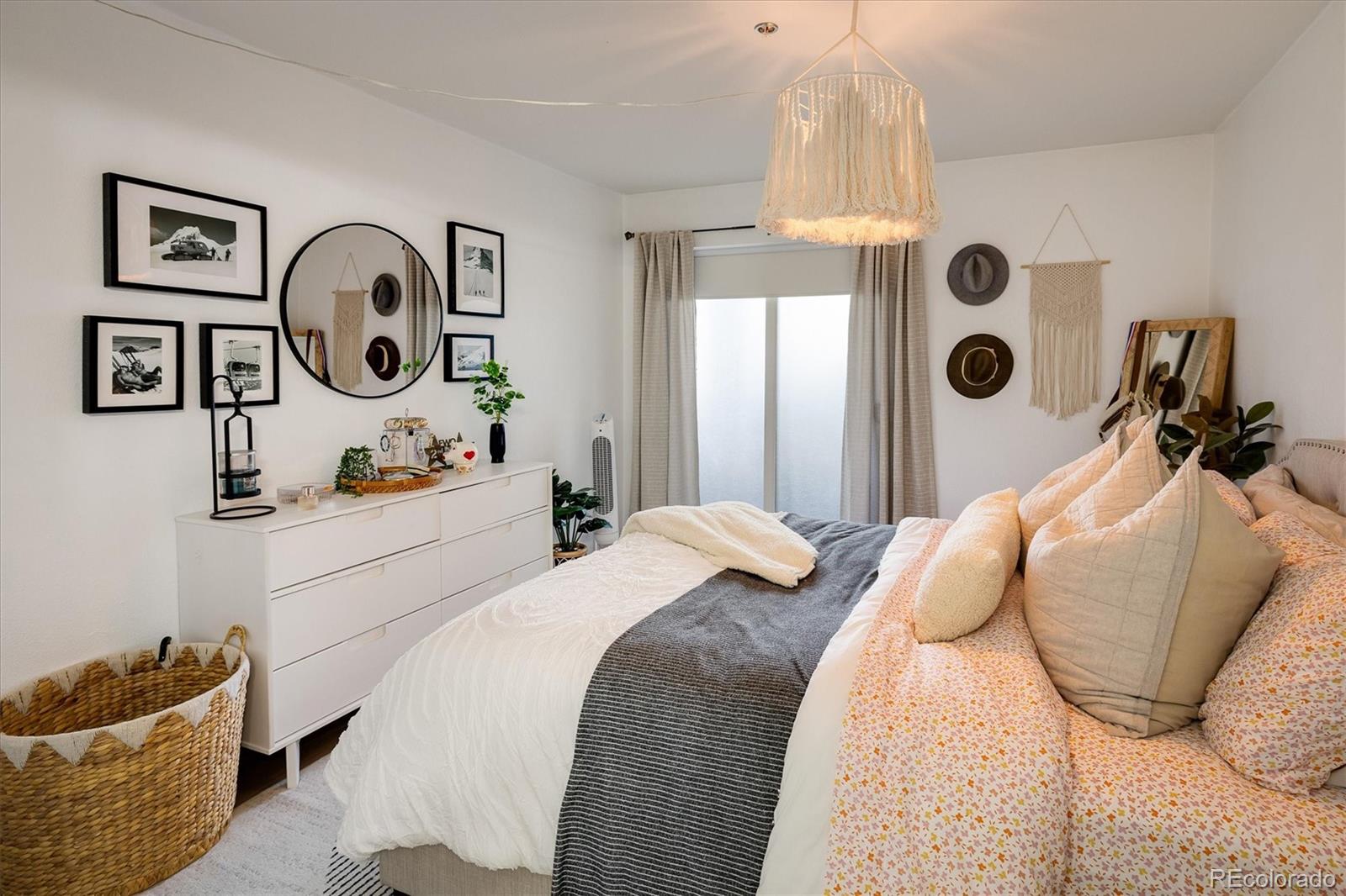 935 Broadway, Unit 104 Boulder, CO 80302 - Photo 10 of 30 a bedroom with bed and a window