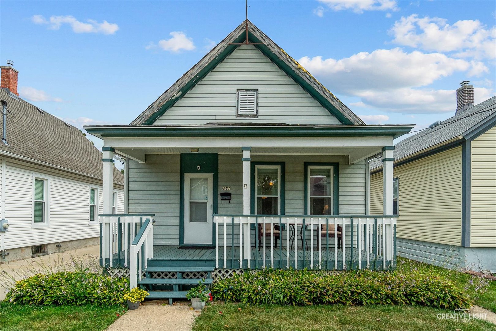 a front view of a house with garden