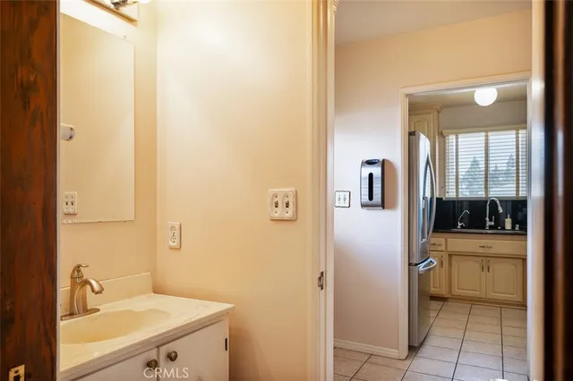 a bathroom with a sink and mirror