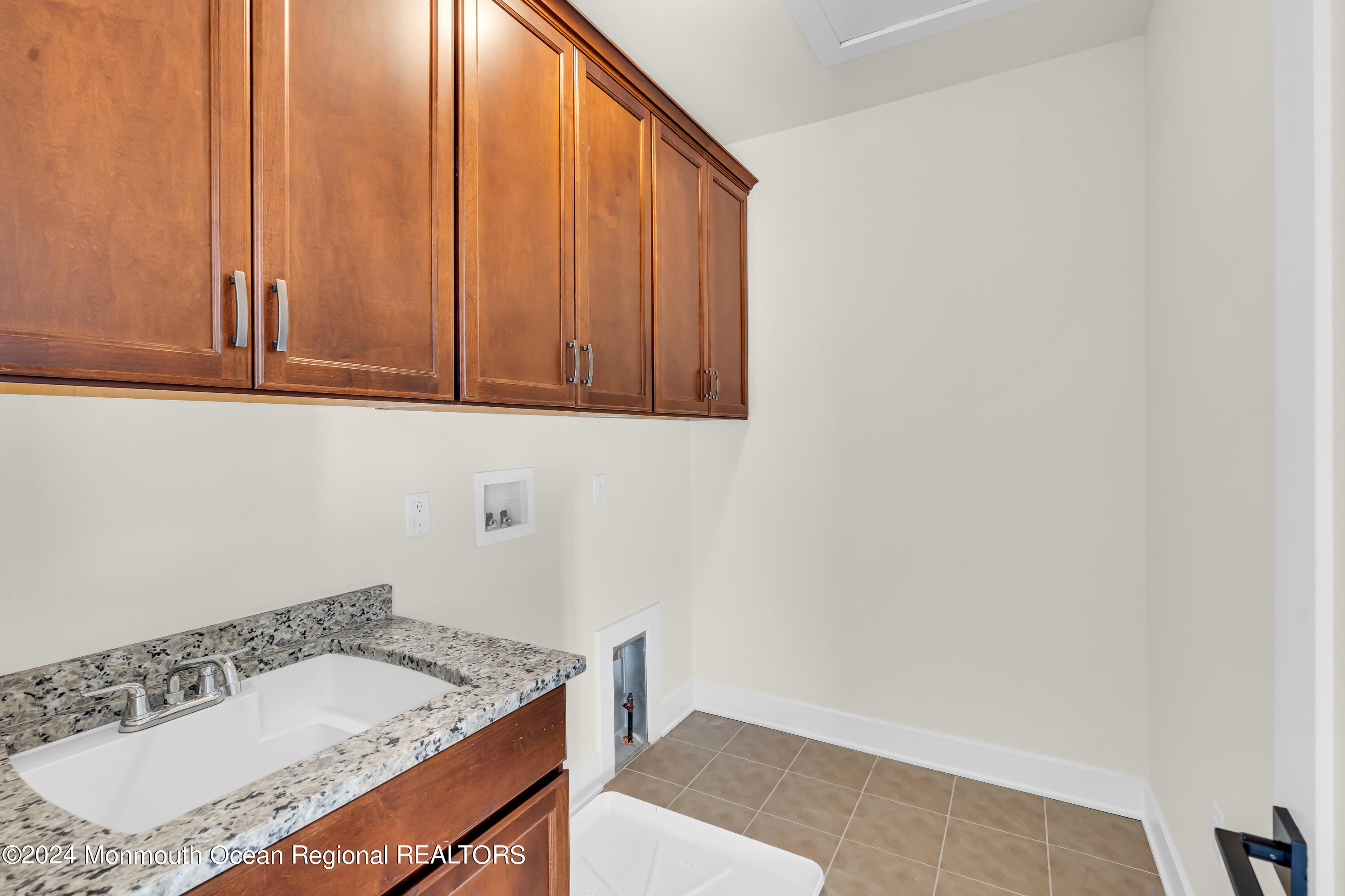 6 Augustus Drive Middletown, NJ 07748 - Photo 20 of 28 a bathroom with a granite countertop sink and a mirror