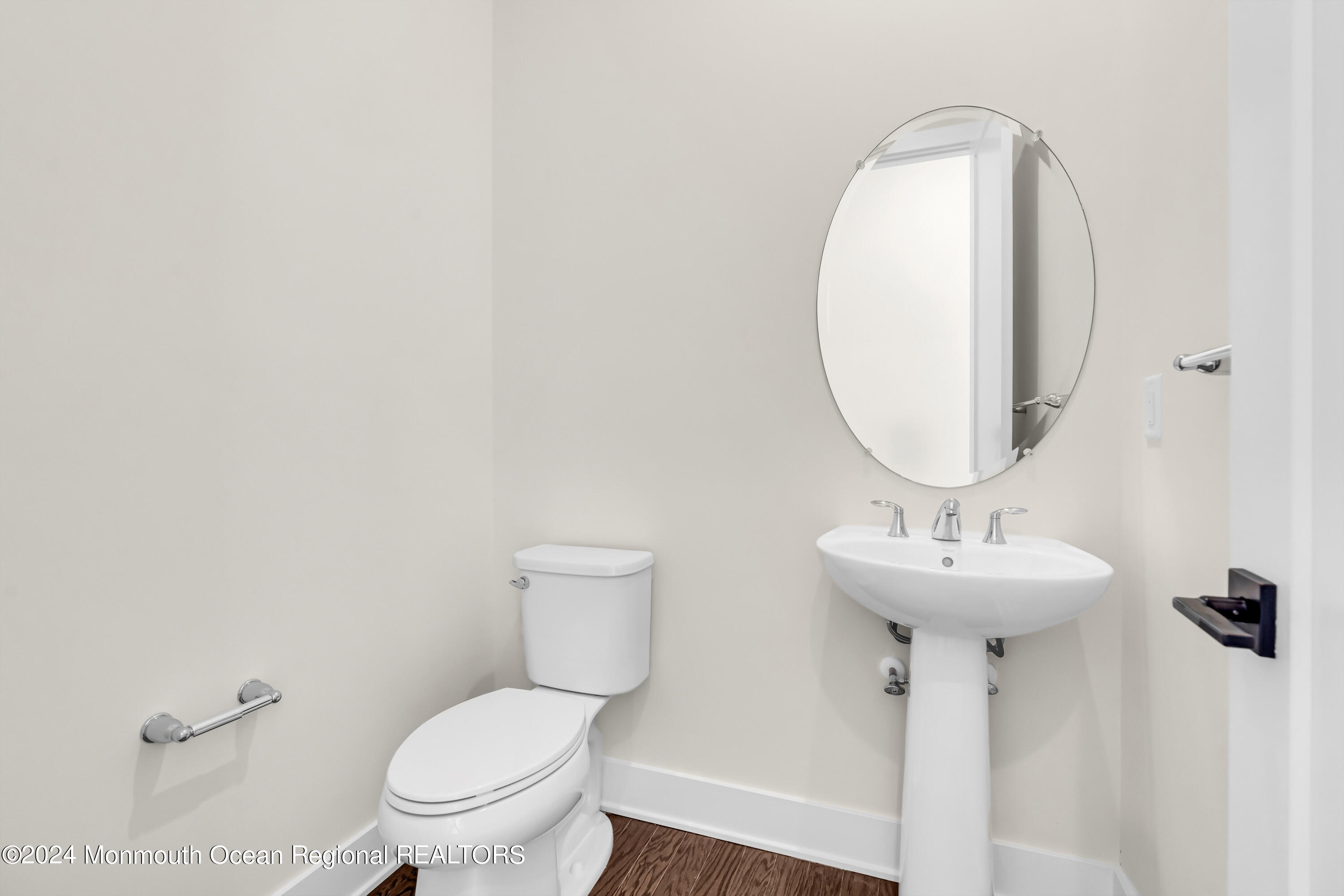 6 Augustus Drive Middletown, NJ 07748 - Photo 5 of 28 a bathroom with a toilet sink and mirror